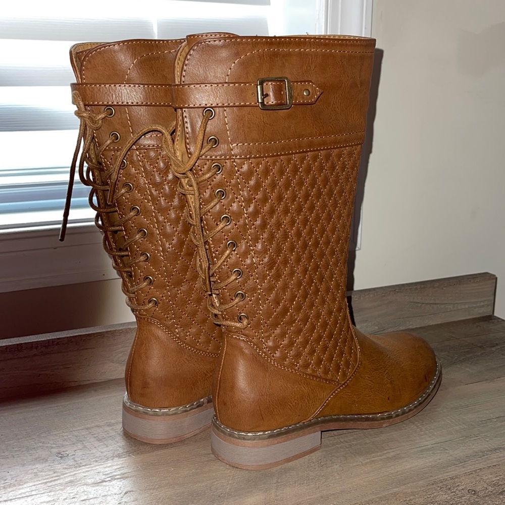Kids size 4 lace tall boots. Good condition